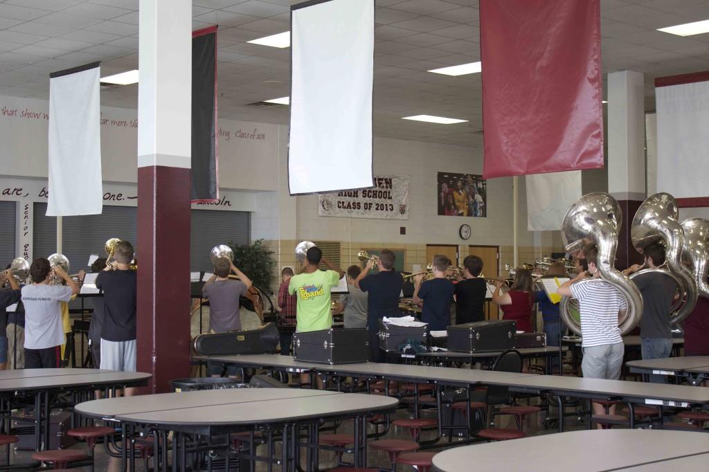 The band practices in the cafeteria as they get ready for their first performance of the year later this week.