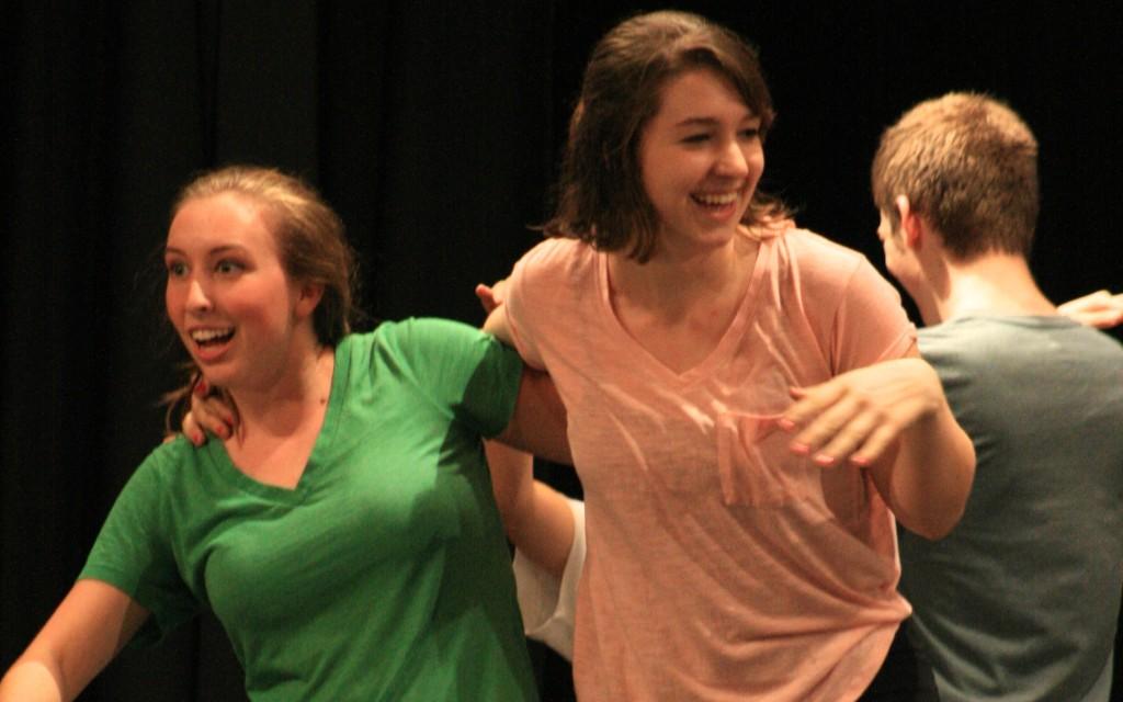National Merit semifinalist and Bearden senior Alison Jobe (right) rehearses on stage with Ashley Slimp.