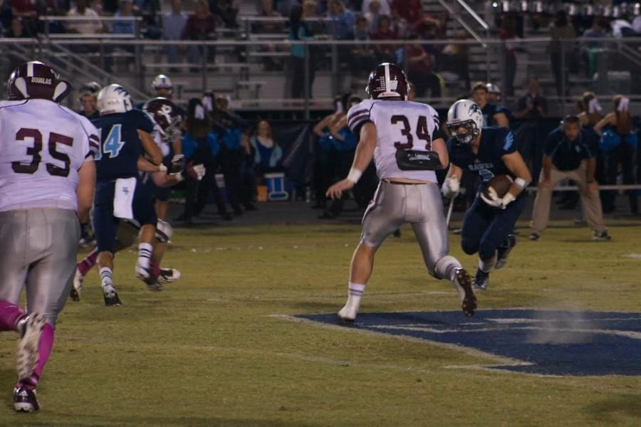 Griffin DeLong looks to make a tackle against Hardin Valley last year.