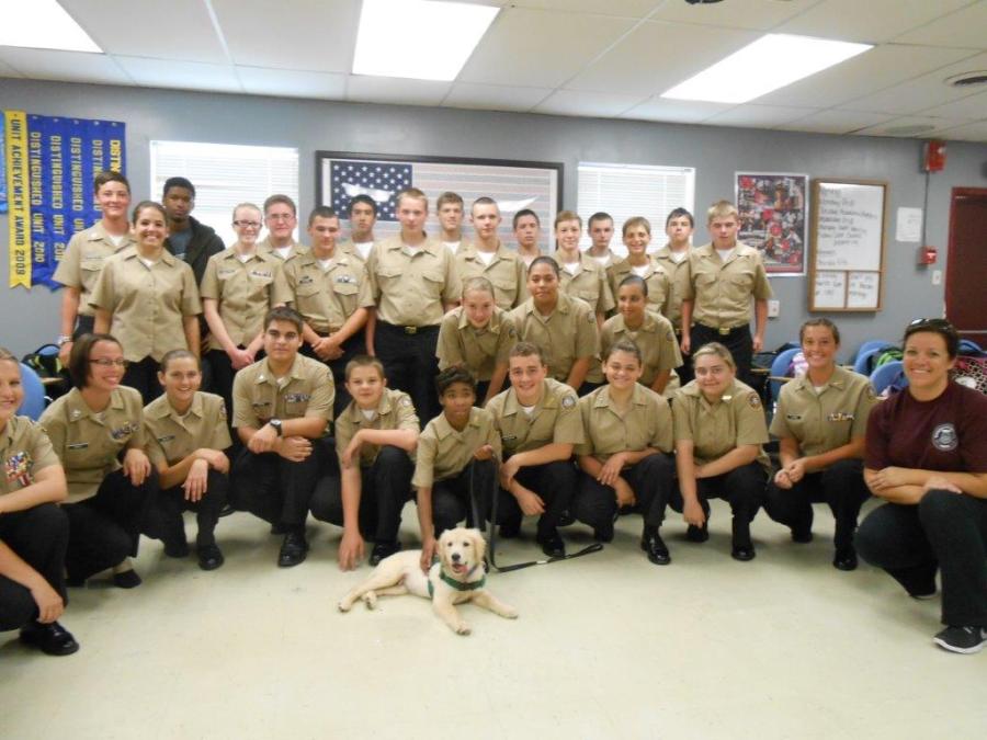 Beardens NJROTC poses with Patriot, the next service dog the group is sponsoring. ROTC is still accepting donations.