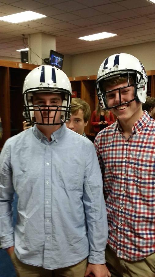 Bearden seniors Andrew Witt and Andrew Bumpas try on Titans helmets while on the DECA field trip.