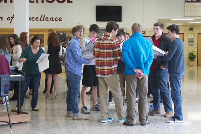 Ms. Mary Sexton (left) works with a group of Bearden Singers during school.