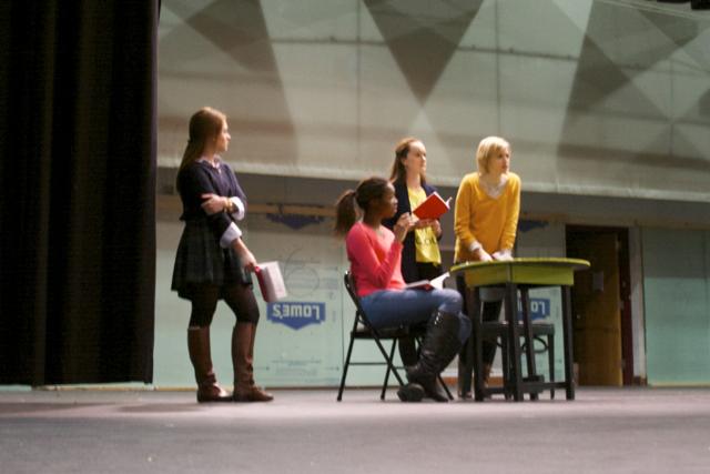 Junior Caroline Cornett and seniors Morgan Johnson, Caroline Rogers, and Alyse McCamish (left to right) rehearse on stage during fourth block.