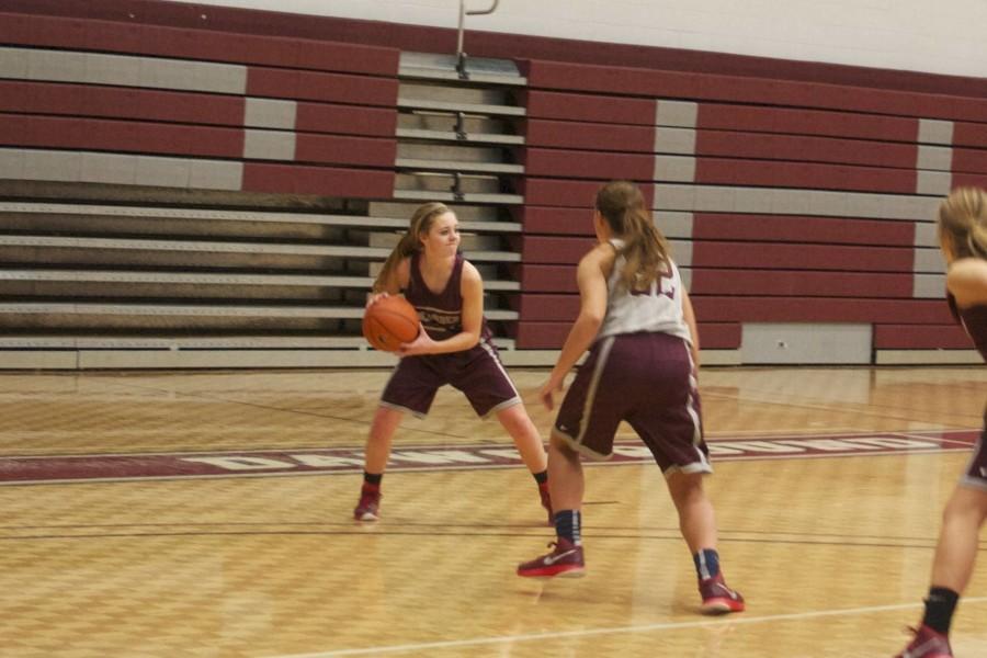 Holly Hagood runs the point during practice, while being guarded by freshman Kendall Clark.