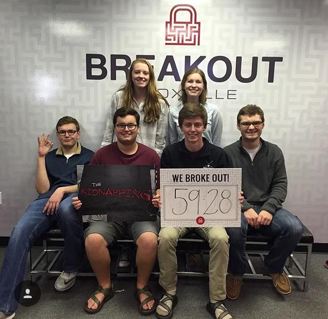 Bearden seniors Annie Smith, Perry Johns, Graham Benefiel, Derek Anderson, Matt Howard, and Jackson Craig celebrate after their successful escape game experience.
