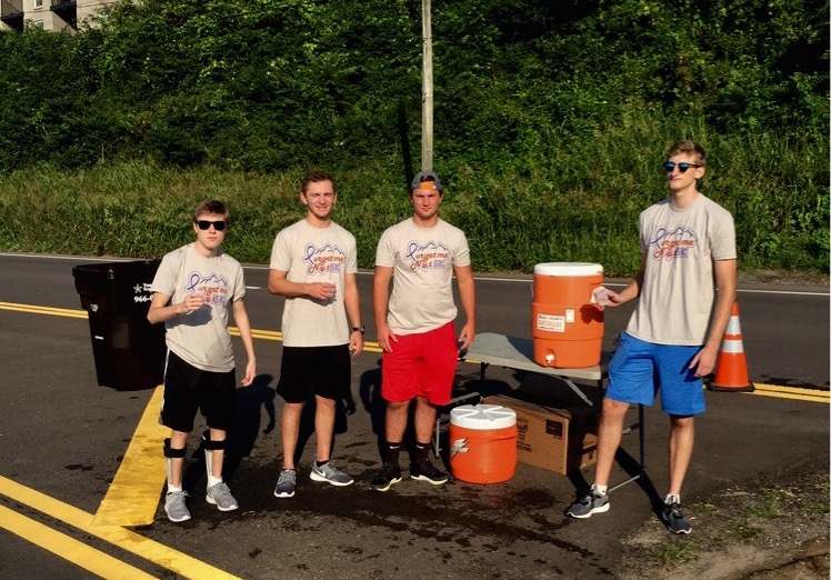 CEO Will Gross (left) work with fellow seniors Matt Stubblefield, Brandon Jacoby, and Justin Ketterl at the Forget Me Not 5k this weekend.