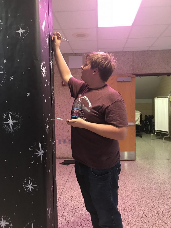 Bearden sophomore Thomas Knight works on decorations for this weekends convention.
