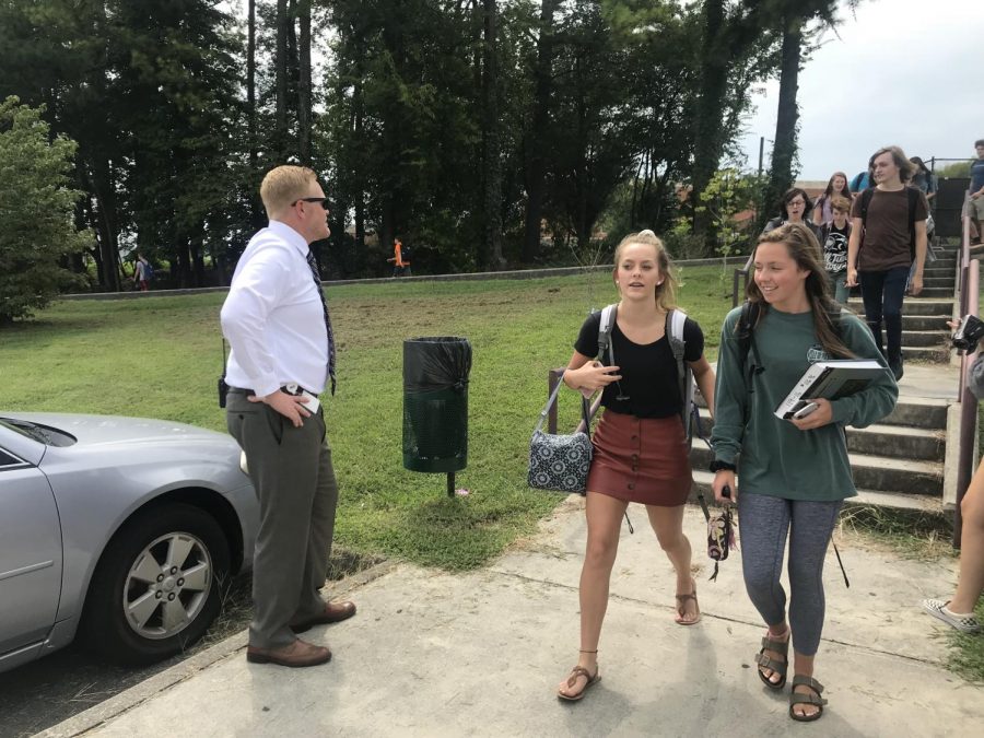 New Bearden principal Mr. Jason Myers greets seniors in the Dawg Lot as they leave school for the day.