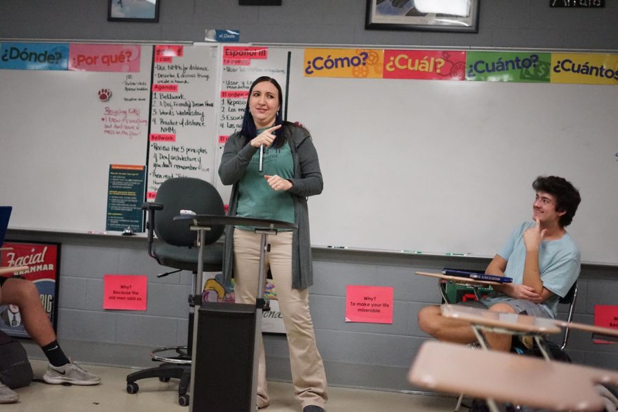Sophomore Mikayil Birdal laughs as ASL teacher Ms. Karen Latus cracks a joke during class.