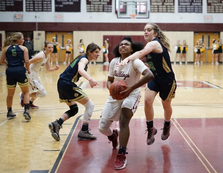 Tytiaira Spikes drives toward the basket in a recent win against Catholic.