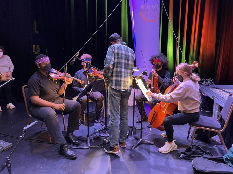 Bearden orchestra students rehearse for their performance with FABBA at the Bijou.