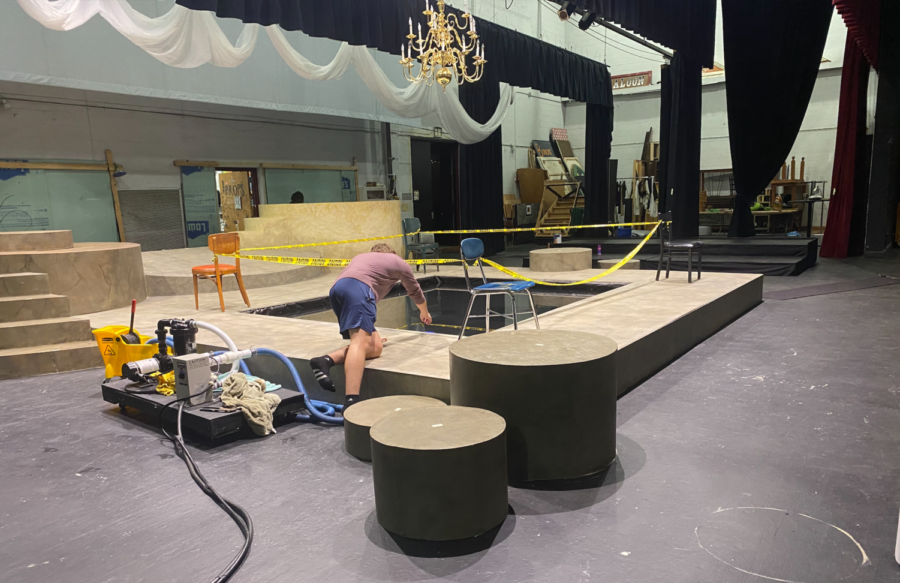 Crew set head Josh Leslie checks the levels in the pool on stage for Beardens production of Metamorphoses. Leslie led the construction of the pool.
