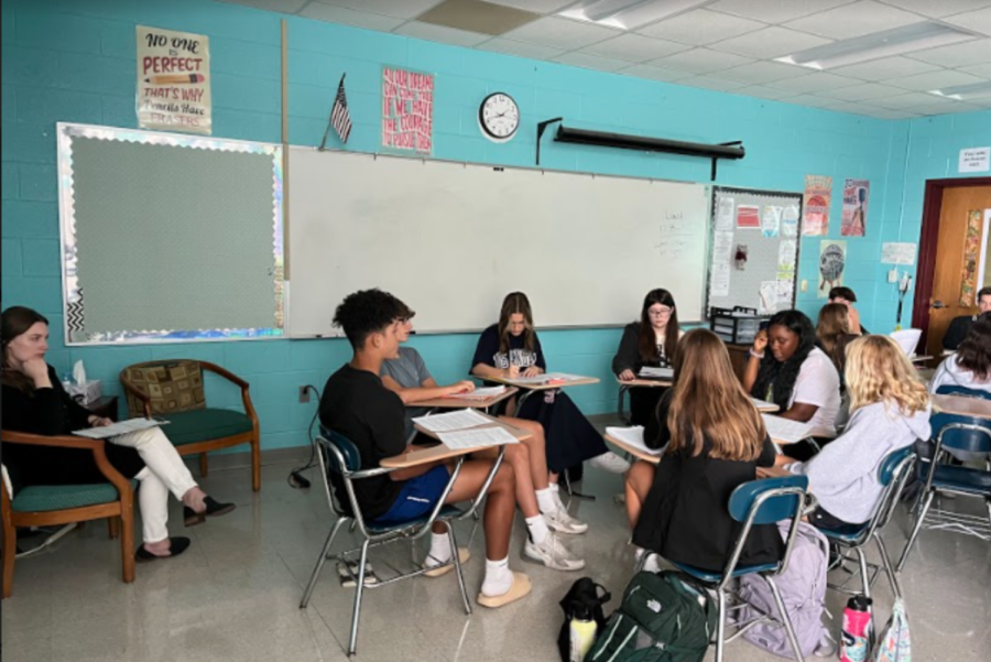 Mrs. Ashleigh Griswold oversees a group discussion in her sophomore English class this week.