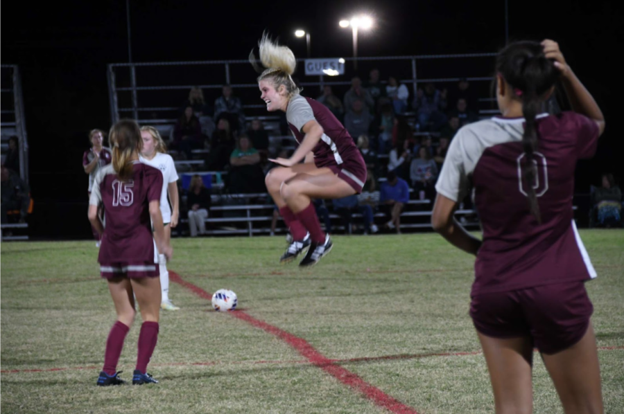 Brinley Murphy jumps into the air before kickoff in a game earlier this year. The senior striker is now the programs all-time leading scorer with 97 career goals.