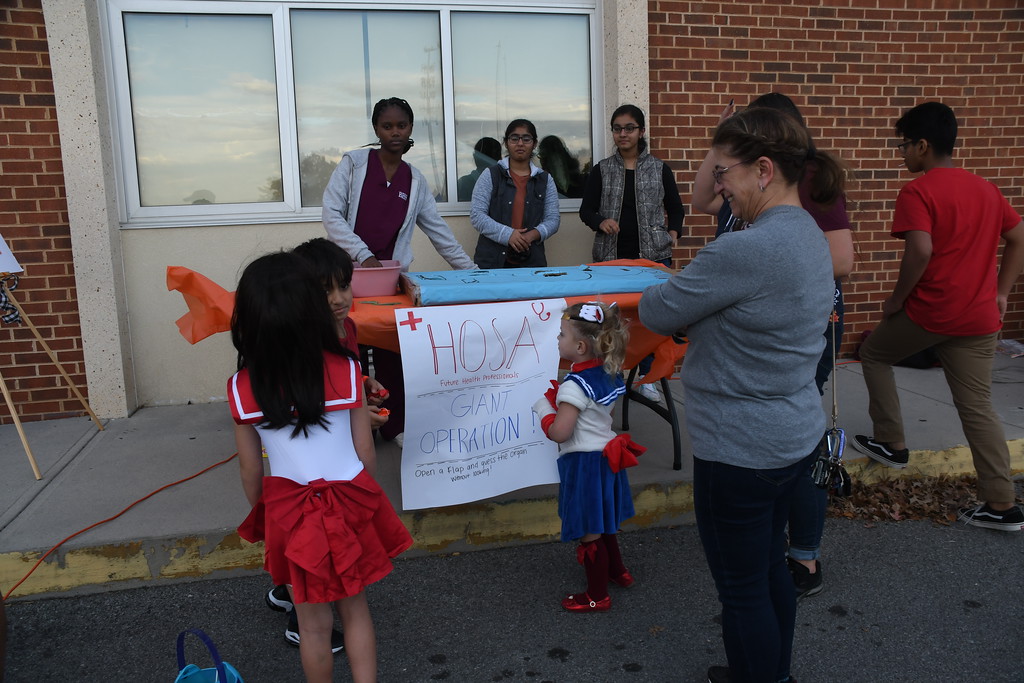 HOSA students welcome Fall Festival guests to their table at last years event.