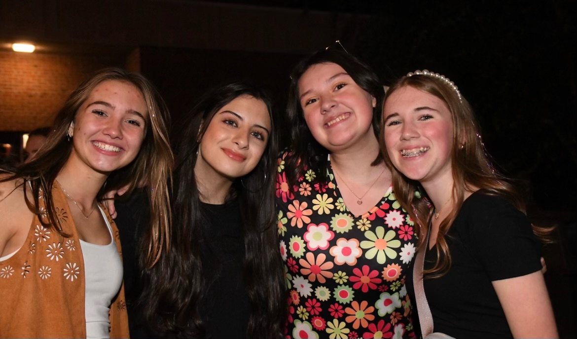 Seniors Izzy Galehouse, Hasti Saleh, Kate Bosi, and Cameron Mize (left to right) pose for a picture at homecoming last year.