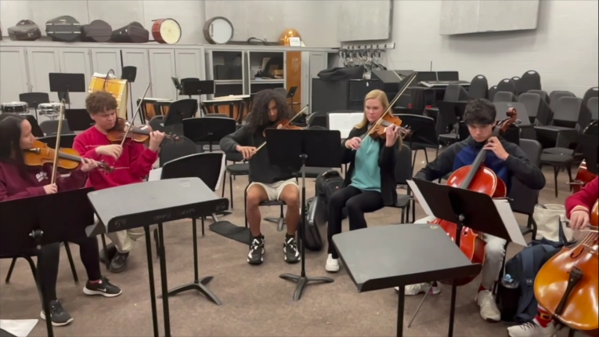 Bearden senior Nicholas McIntyre (second from left) arranged two songs for this weeks Bearden orchestra concert.