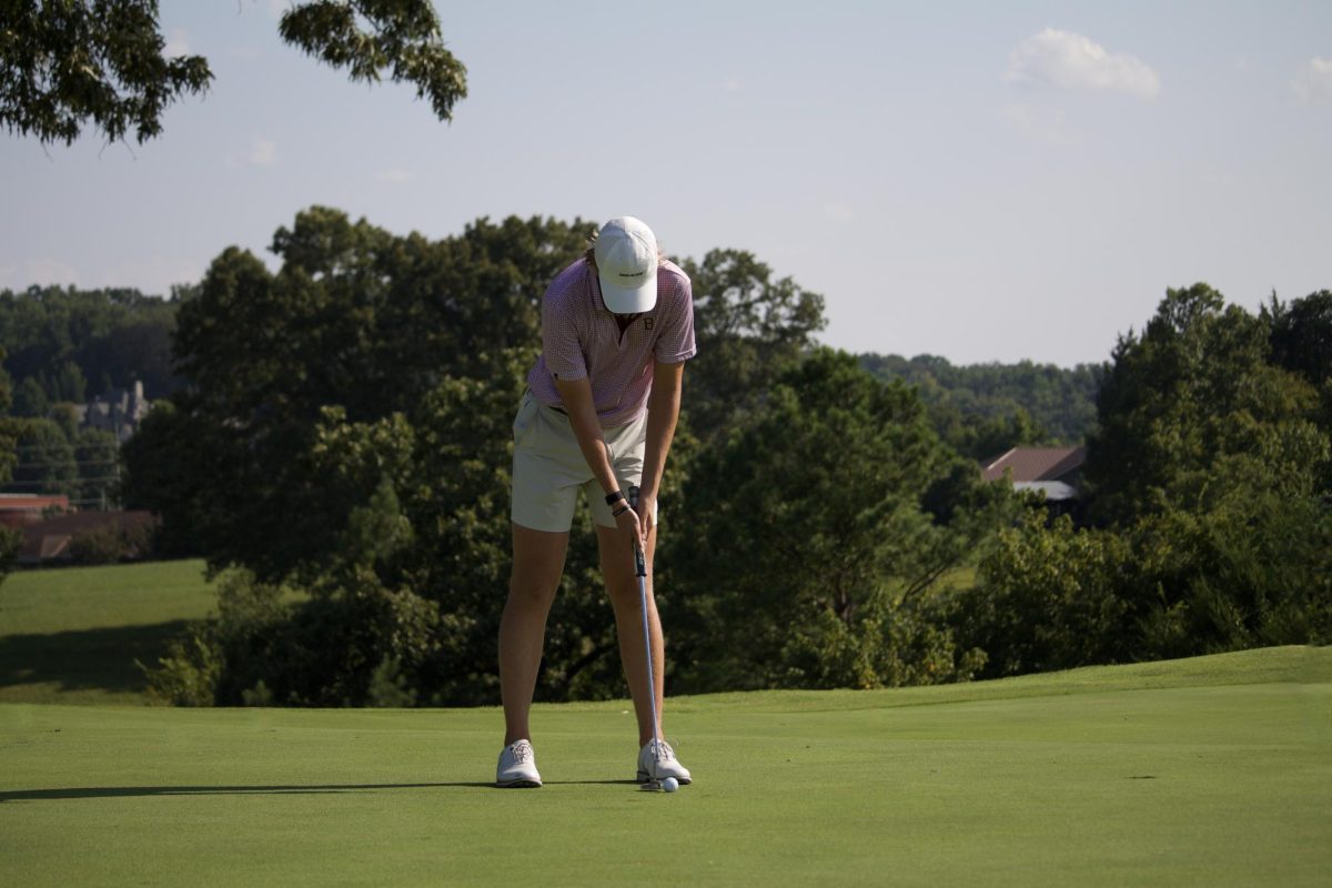 Senior Bryce Harmon putts in a recent golf match. The UT-Martin commit has taken on greater leadership responsibilities this year.