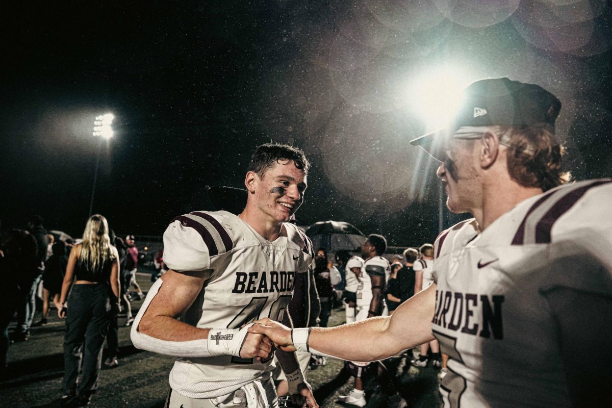 Paxton Parrott (left) shakes his brother Drew's hand after a Bearden win. Paxton has become a big part of the Bearden defense in recent games.