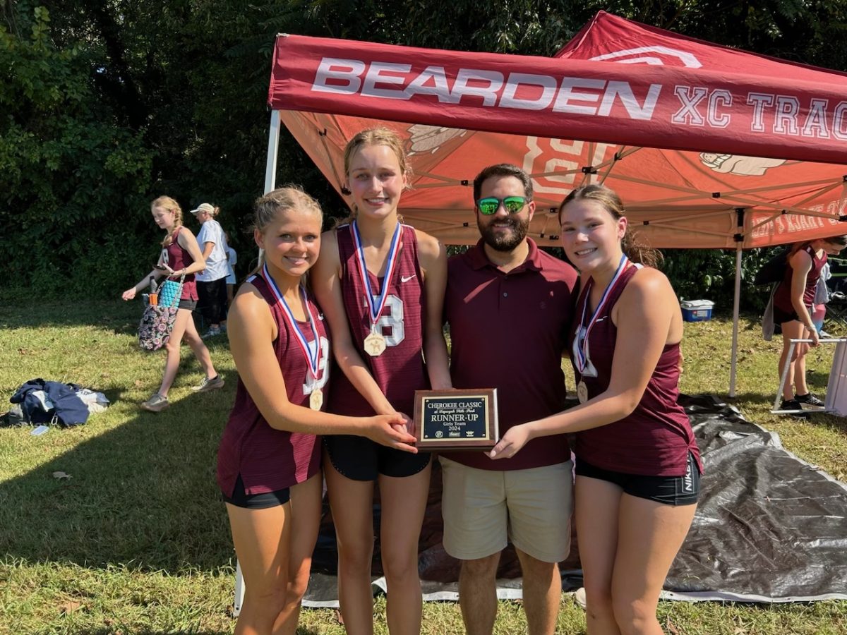 Brielle Picket (far left) and Haley Jordan (second from left) will run in Friday's state meet.