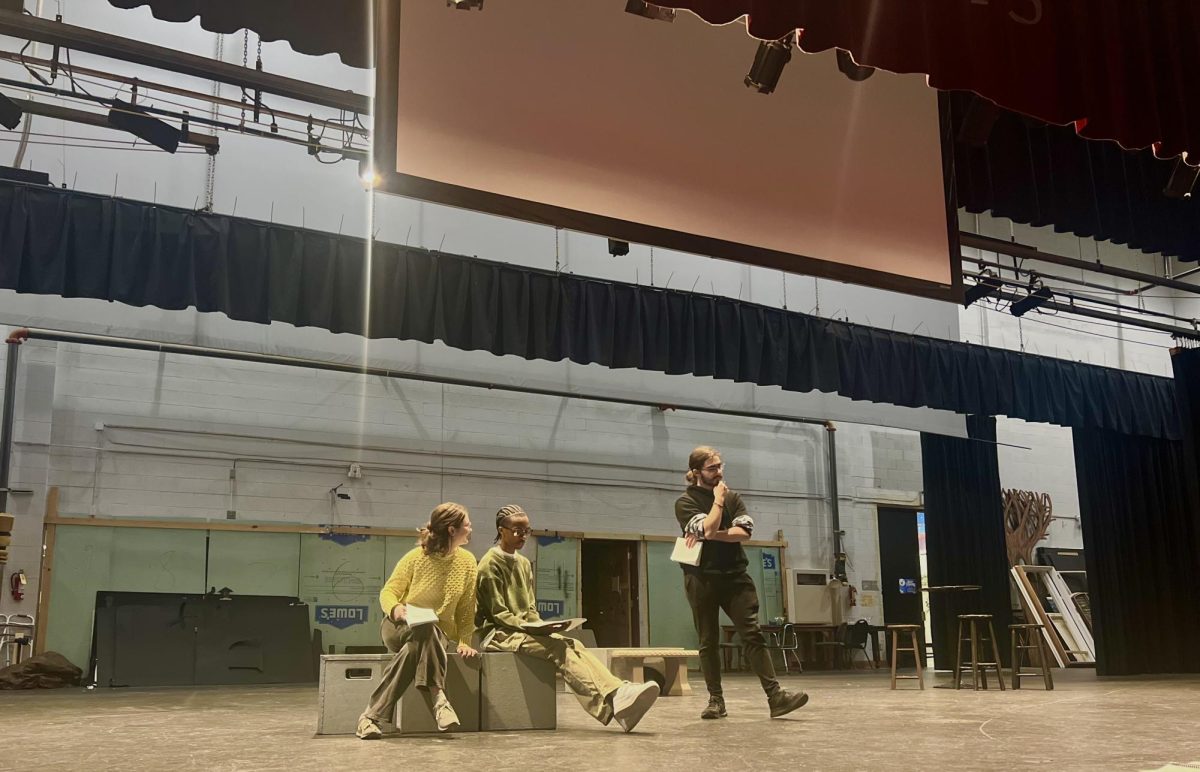 Reagan Smith (left) and Justin Lattimore Jr. (middle) talk to Aiden Vinh, who plays Polonius, during a recent rehearsal. Lattimore and Smith play Rosencrantz and Guildenstern, respectively.