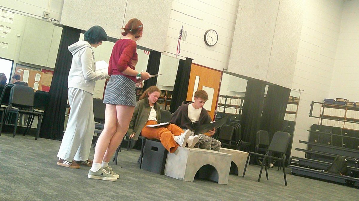 Senior Natalie Newman (middle) and junior Joseph Swinson (right) rehearse for the upcoming one-act production of "Shadow."