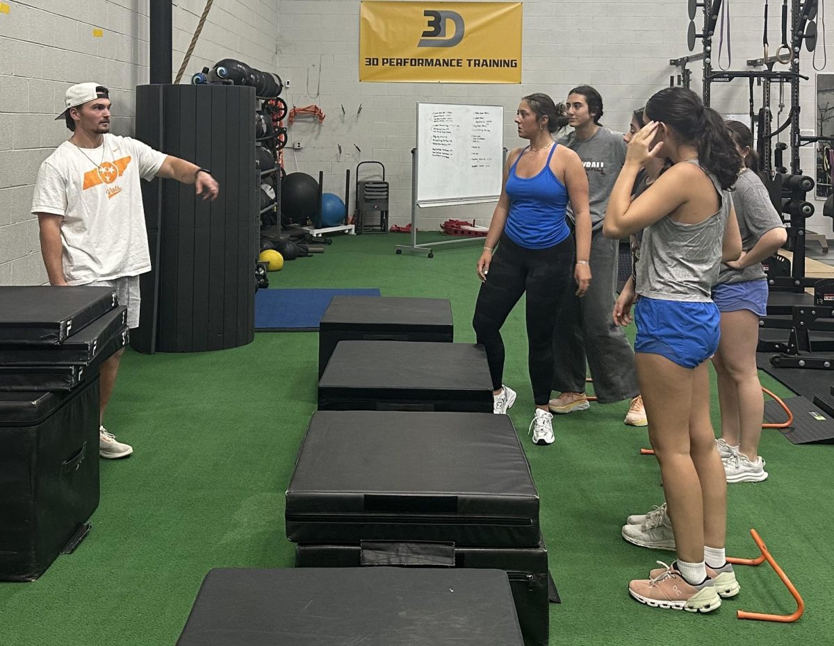 Andrew Carpenter, an athletic trainer at 3D Performance Training, works with Bearden's lacrosse team.
