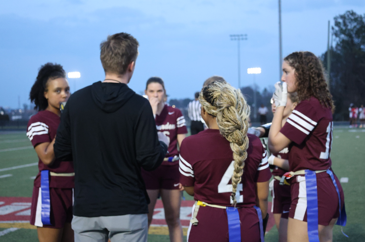 Coach Zach Scott talks to his players during a timeout at a recent game.