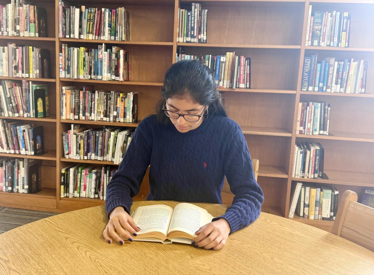 Co-Valedictorian Mery Diaz studies in Bearden's library.